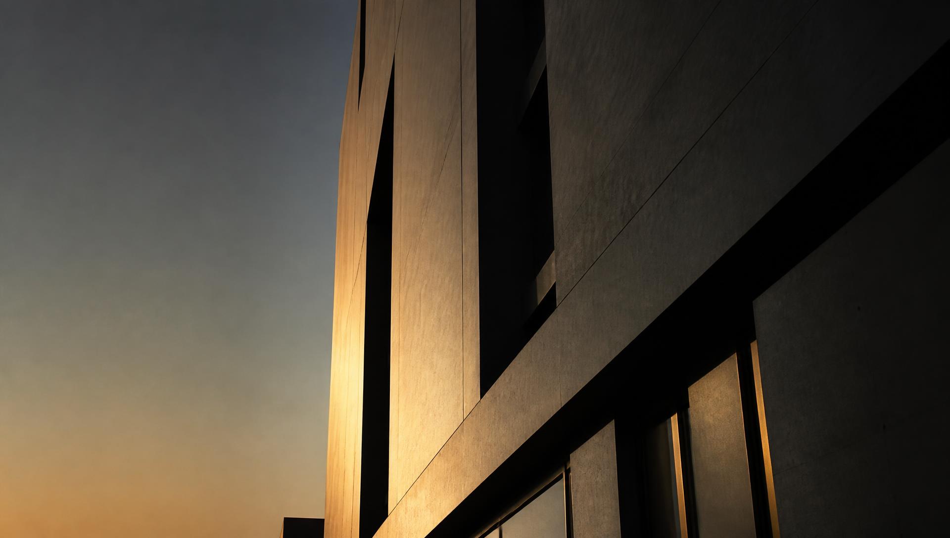 Minimal geometric tower facade at dusk